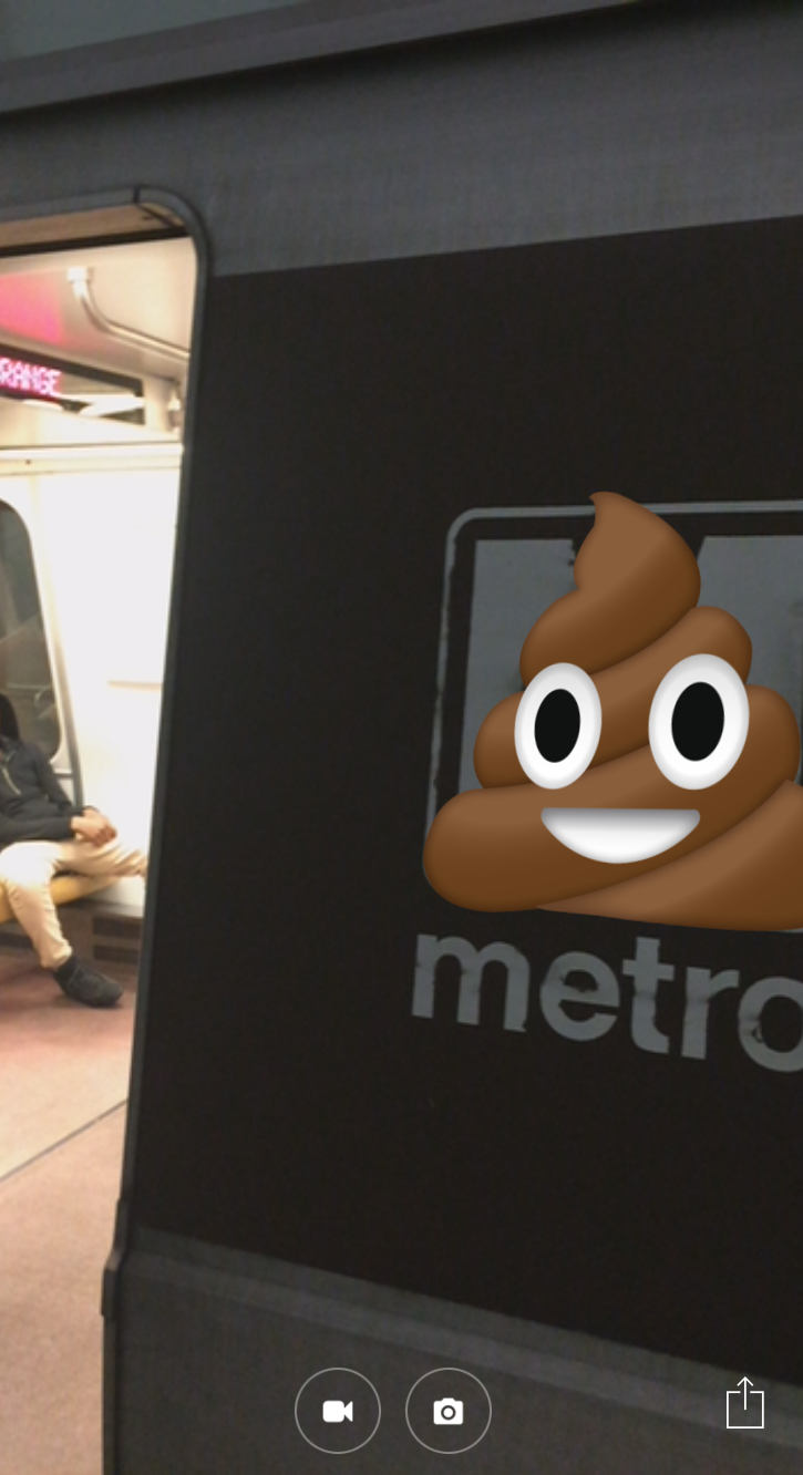Augmented reality that turns Metro's logo into the poop emoji.